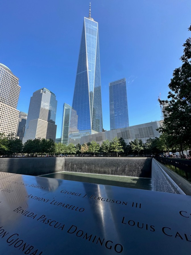 9/11 Memorial, with One World Trade Center in background.