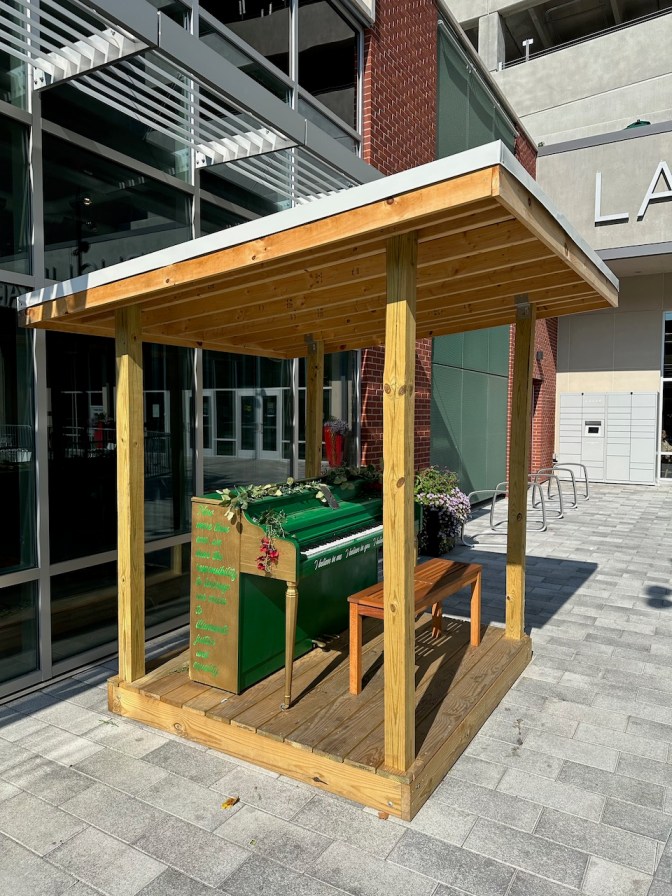 Piano on piazza in front of Lancaster Public Library