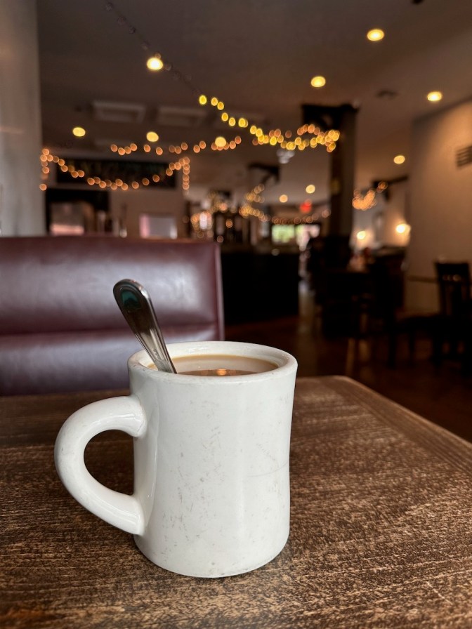 Coffee mug on table in restaurant.