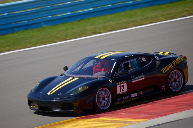 Ferrari on race track.