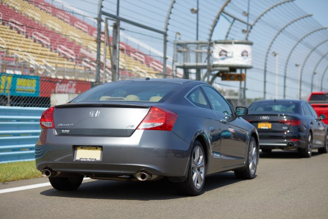 2012 Honda Accord coupe on Watkins Glen International. View from rear quarter.