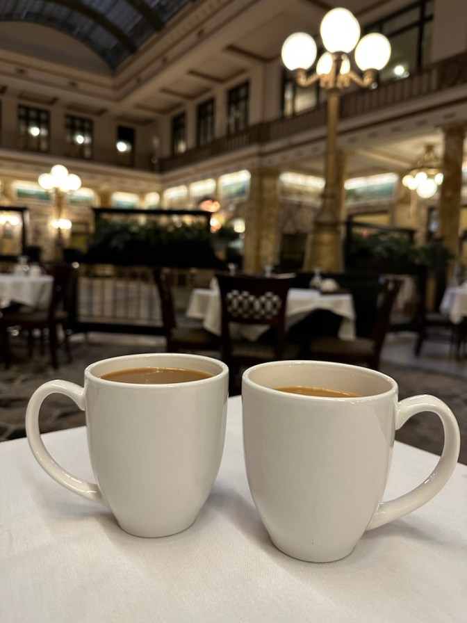 Two cups of coffee on table