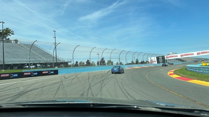 View of cars approaching finish line of Watkins Glen.