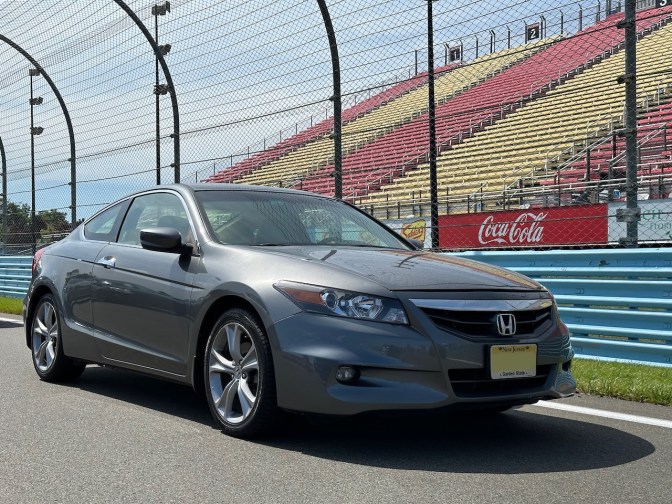 2012 Honda Accord parked in front of Watkins Glen International grandstands.