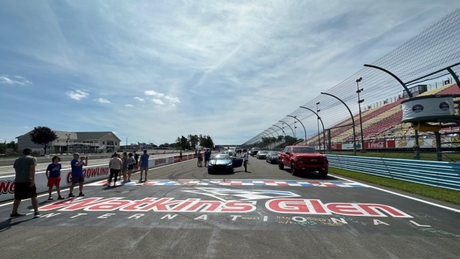 Cars parked in front of starting line for Watkins Glen International.