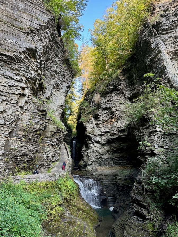 Stone steps on side of gorge, beside waterfall.