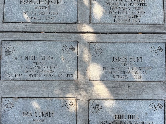 Brick markers with names of Formula One US Grand Prix winners, including James Hunt and Niki Lauda.