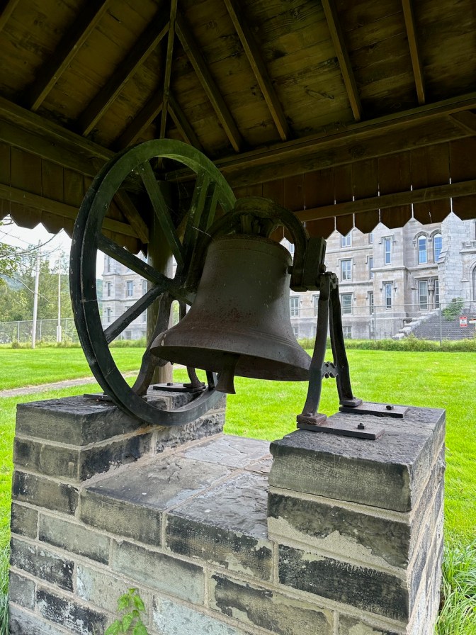Asylum Bell on display outside asylum.