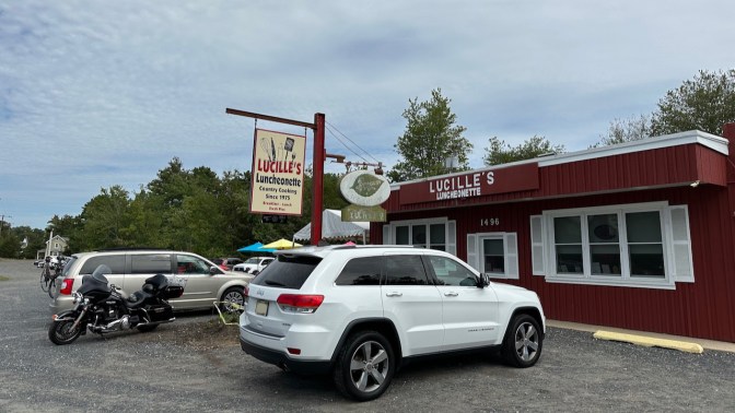 2014 Jeep Grand Cherokee parked in front of Lucille's Luncheonette.