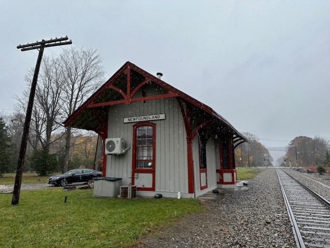 Newfoundland Station, in the rain, with tracks running into distance.