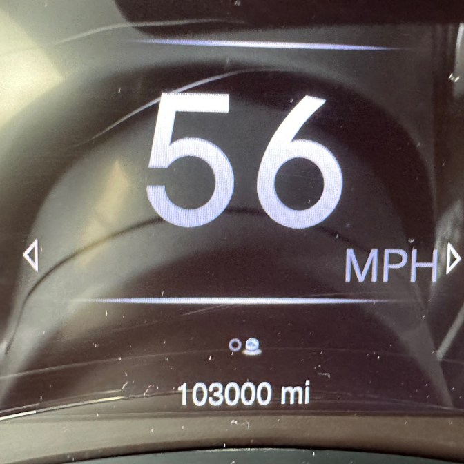 Car odometer reading 103000 miles.