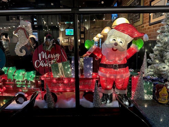 Window of Cape May Fish Market decorated for Christmas.