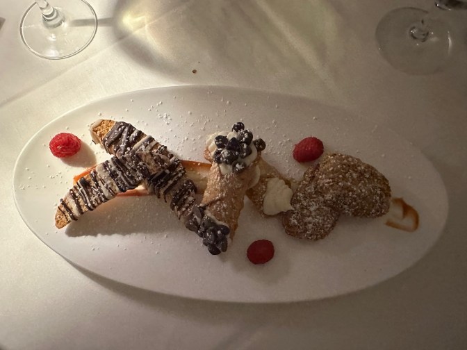 Platter with Italian cookies and cannoli.