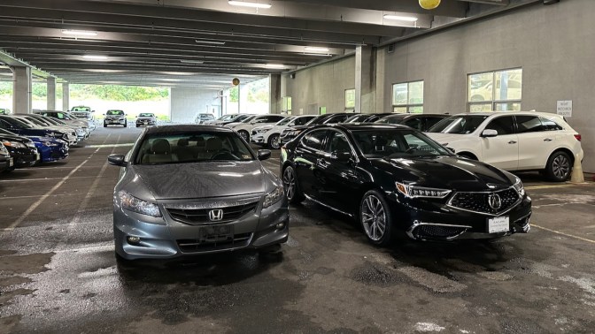 2012 Honda Accord and 2020 Acura TLX in dealership garage.