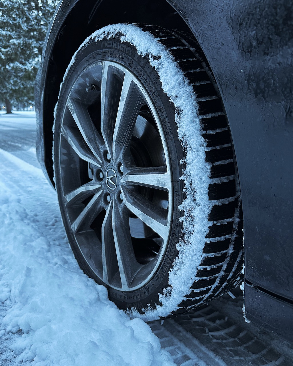 Nokian WR G4 tire on Acura TLX wheel on snowy road.