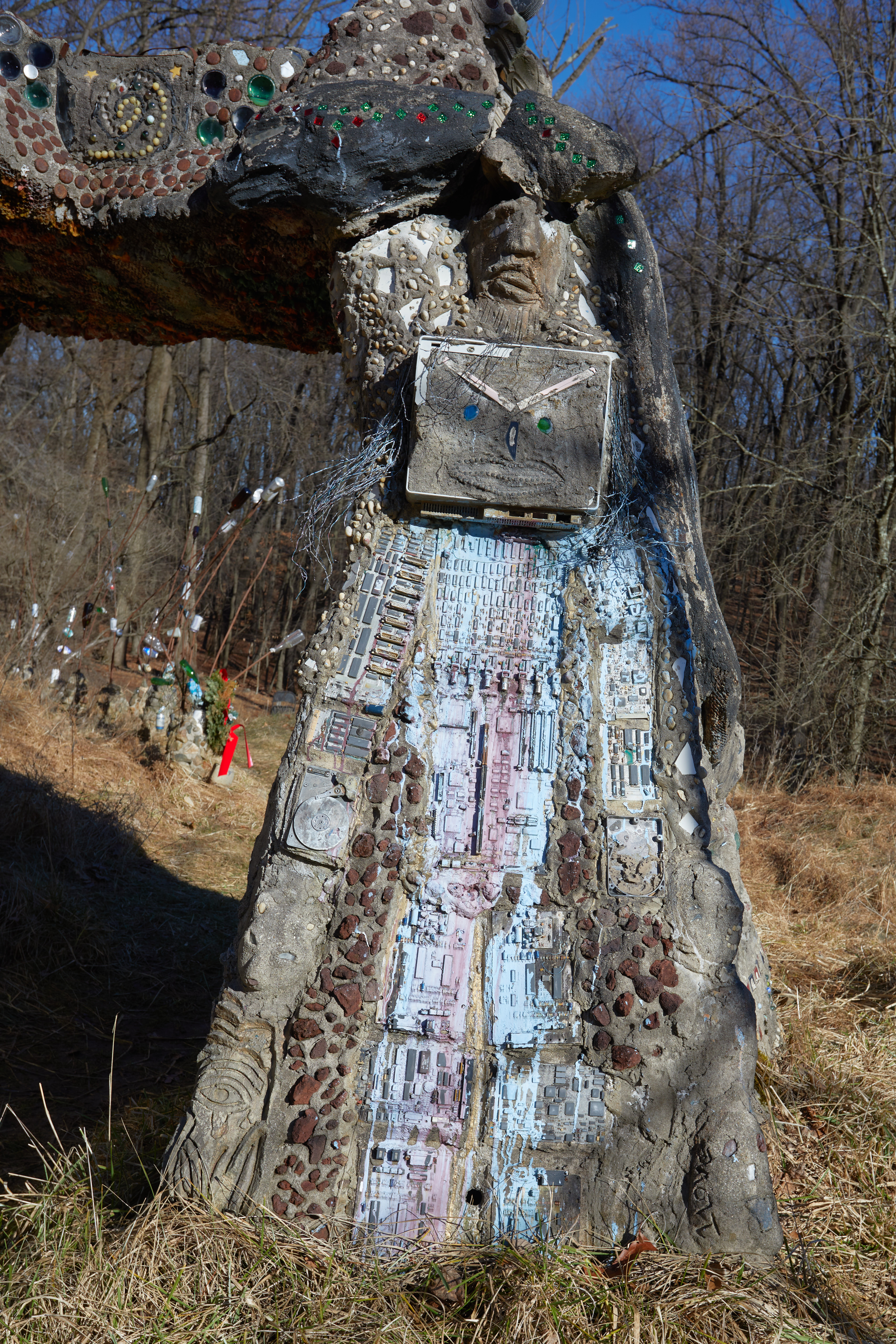 Figure of robot within arch.