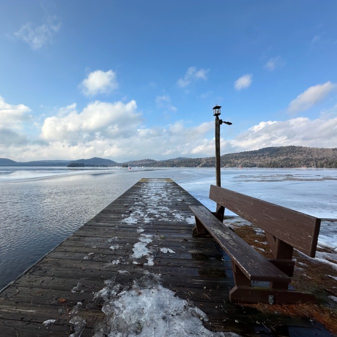 View of Fourth Lake in Inlet, NY, from wooden dock.