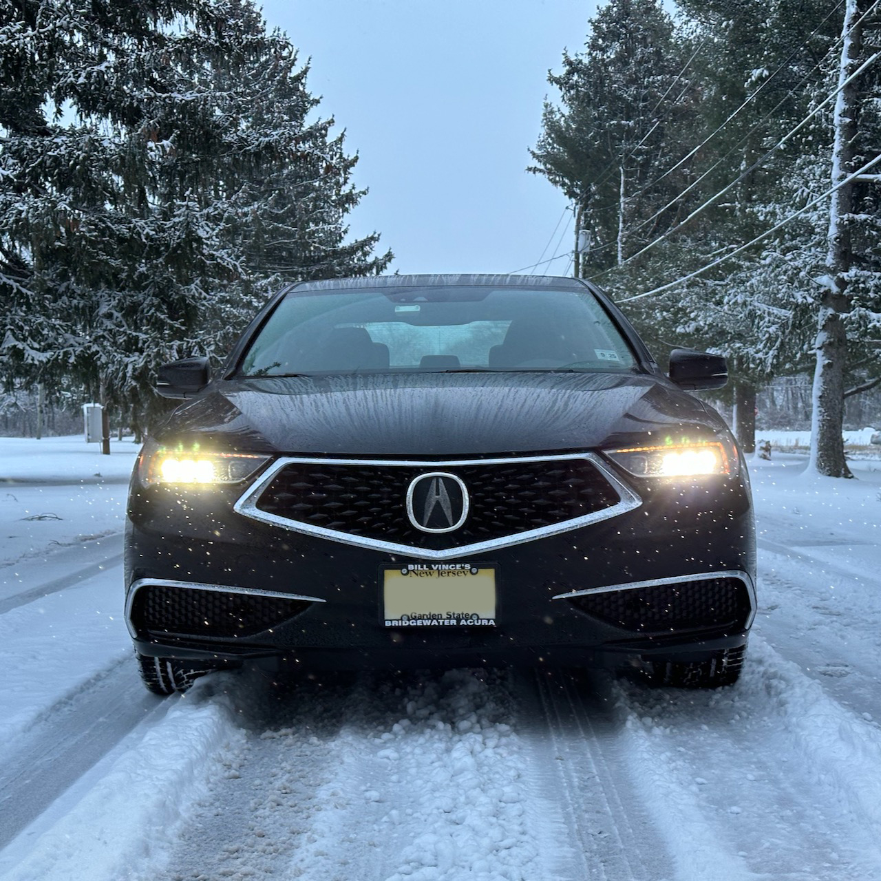 2020 Acura TLX on snowy road.