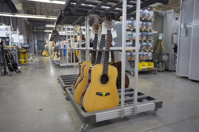 Finished guitars on rack.