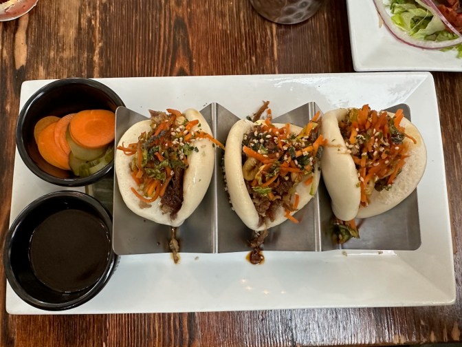 Plate with pork bao buns.