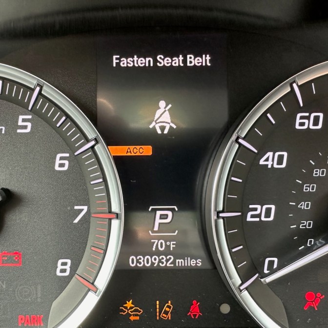 Car odometer reading 30932 miles.