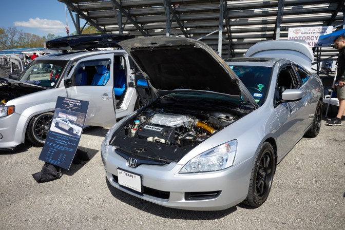 2003 Honda Accord coupe, with sign beside the vehicle on easel.