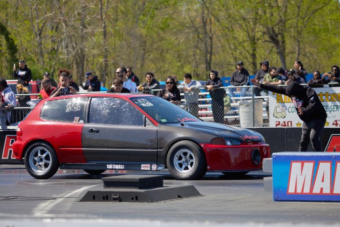 Honda Civic hatchback lining up on starting line.