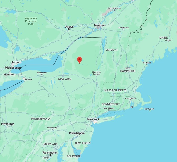 Map of New York, with red pin in location of Adirondack State Park.
