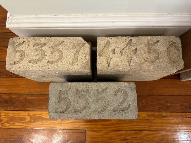 Three numbered grave stones.