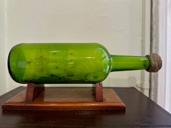 Model ship in green bottle.