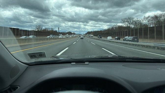 View of NJ Turnpike under cloudy skies.