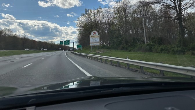 Welcome to Maryland sign by side of highway.