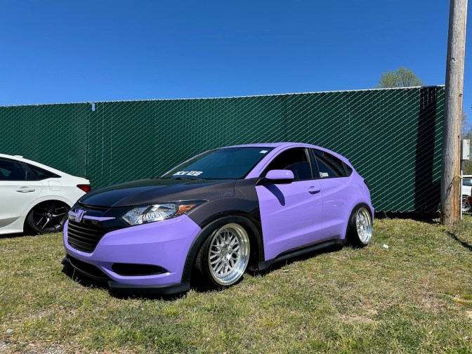 Honda HR-V parked on grass. It has been lowered, and has a blue and black paint scheme.