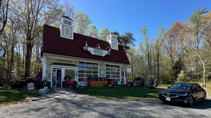 2020 Acura TLX parked in front of antique shop.