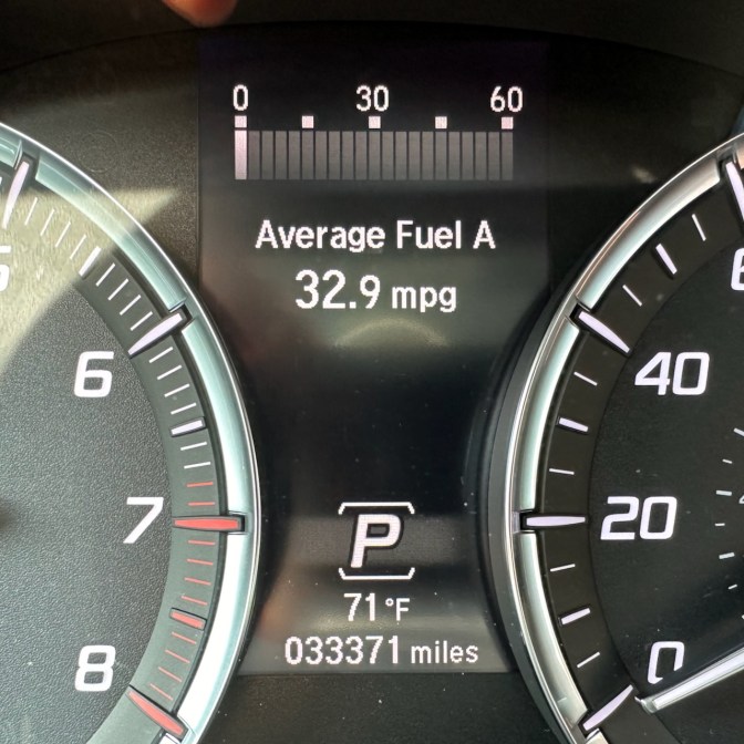 Car odometer reading 33,371 miles.