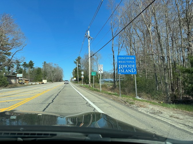 Sign along Route 6 that says DISCOVER BEAUTIFUL RHODE ISLAND.