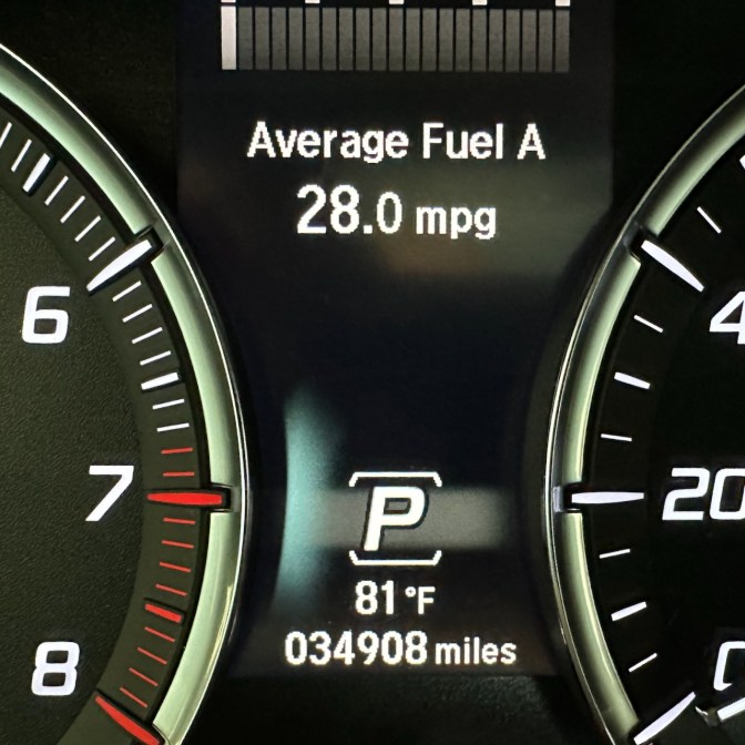 Car odometer reading 34908 miles.