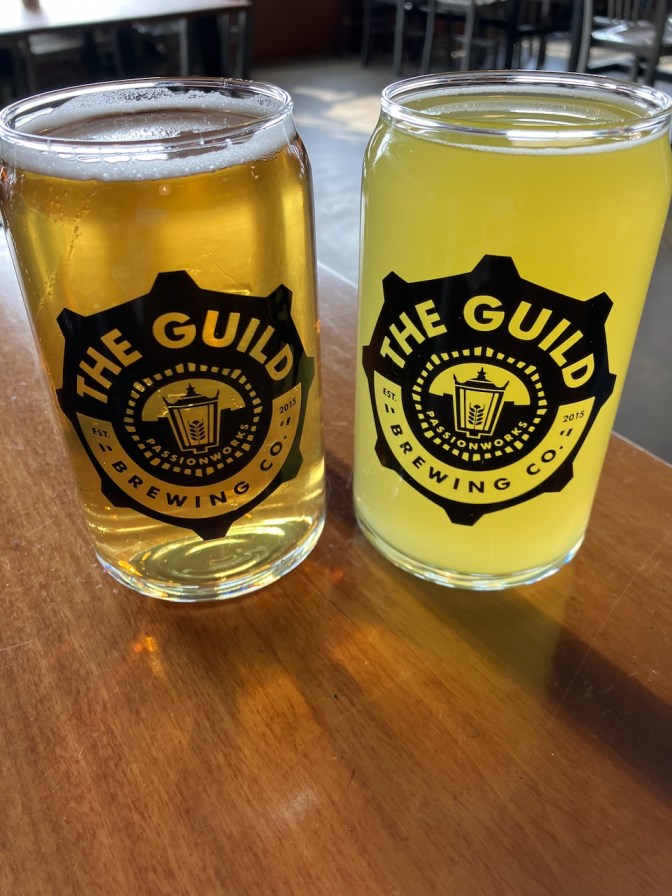 Glass of beer and hard seltzer.