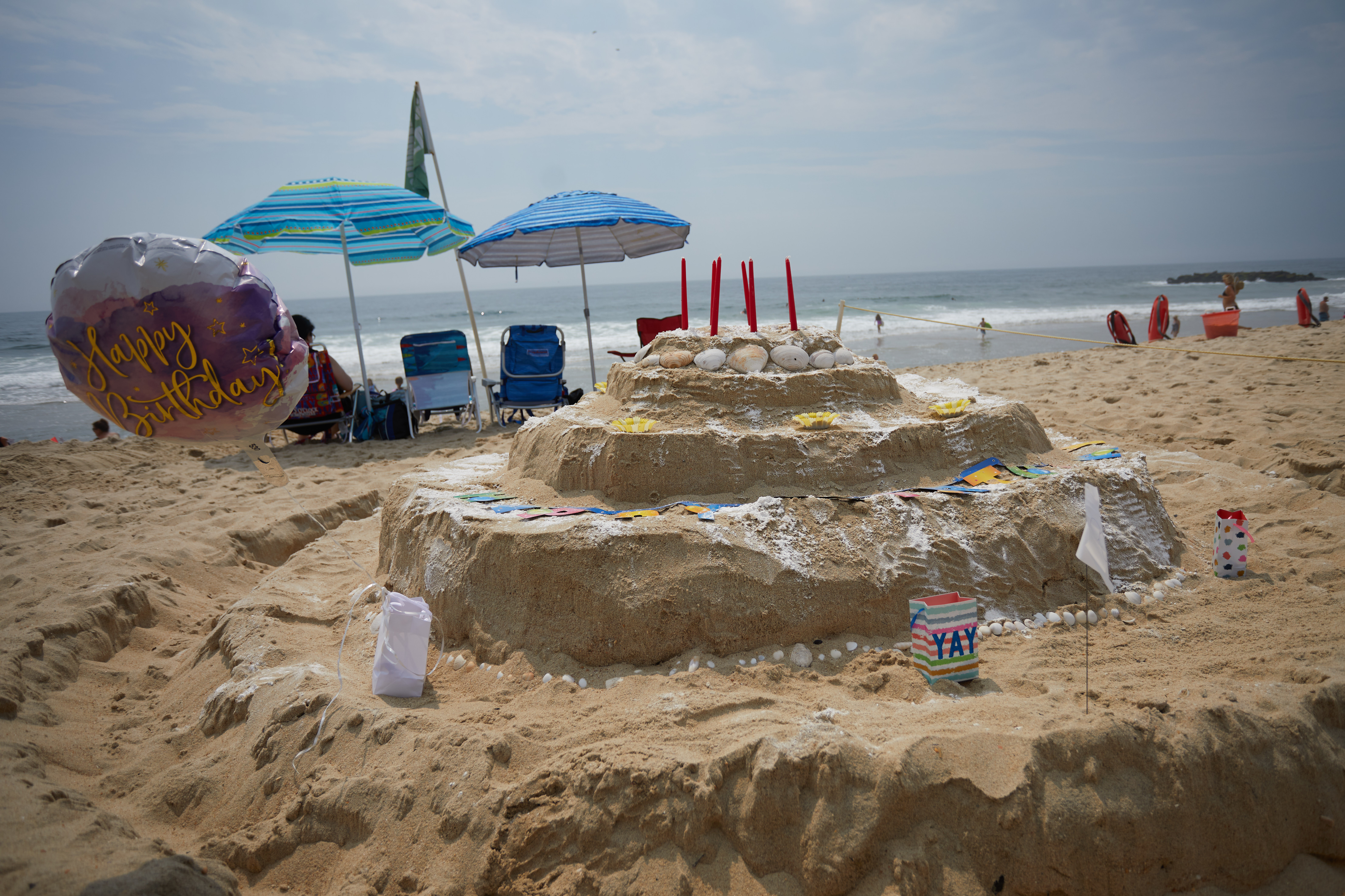Birthday cake sand sculpture.