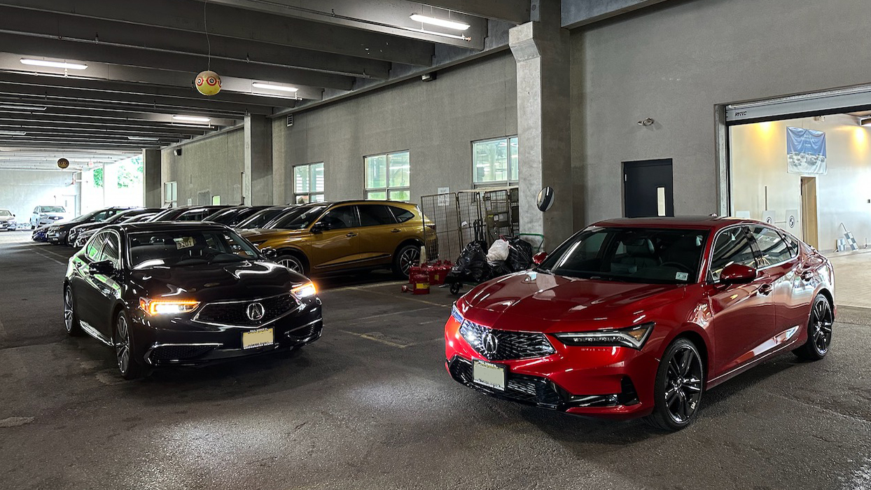 2020 Acura TLX parked in garage beside 2024 Acura Integra.