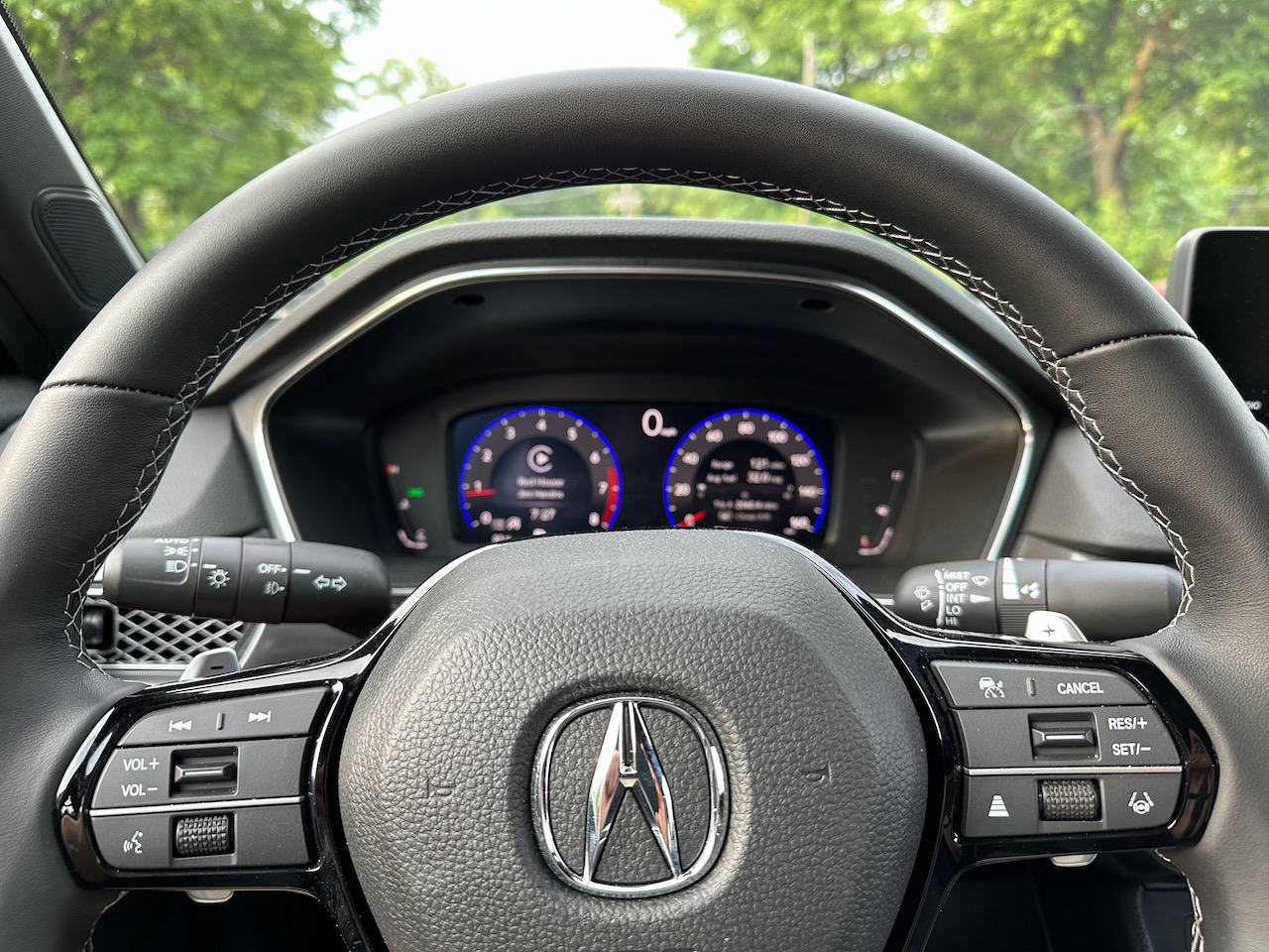 Steering wheel and gauge cluster of Acura Integra.
