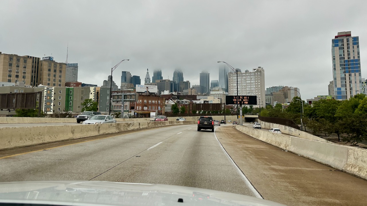View of Philadelphia skyline obscured by clouds.