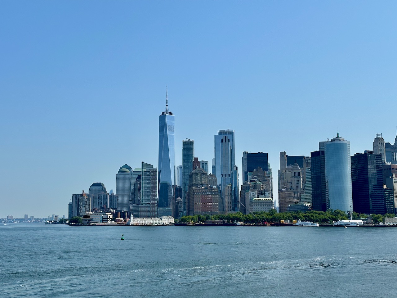 Manhattan skyline with water in foreground.