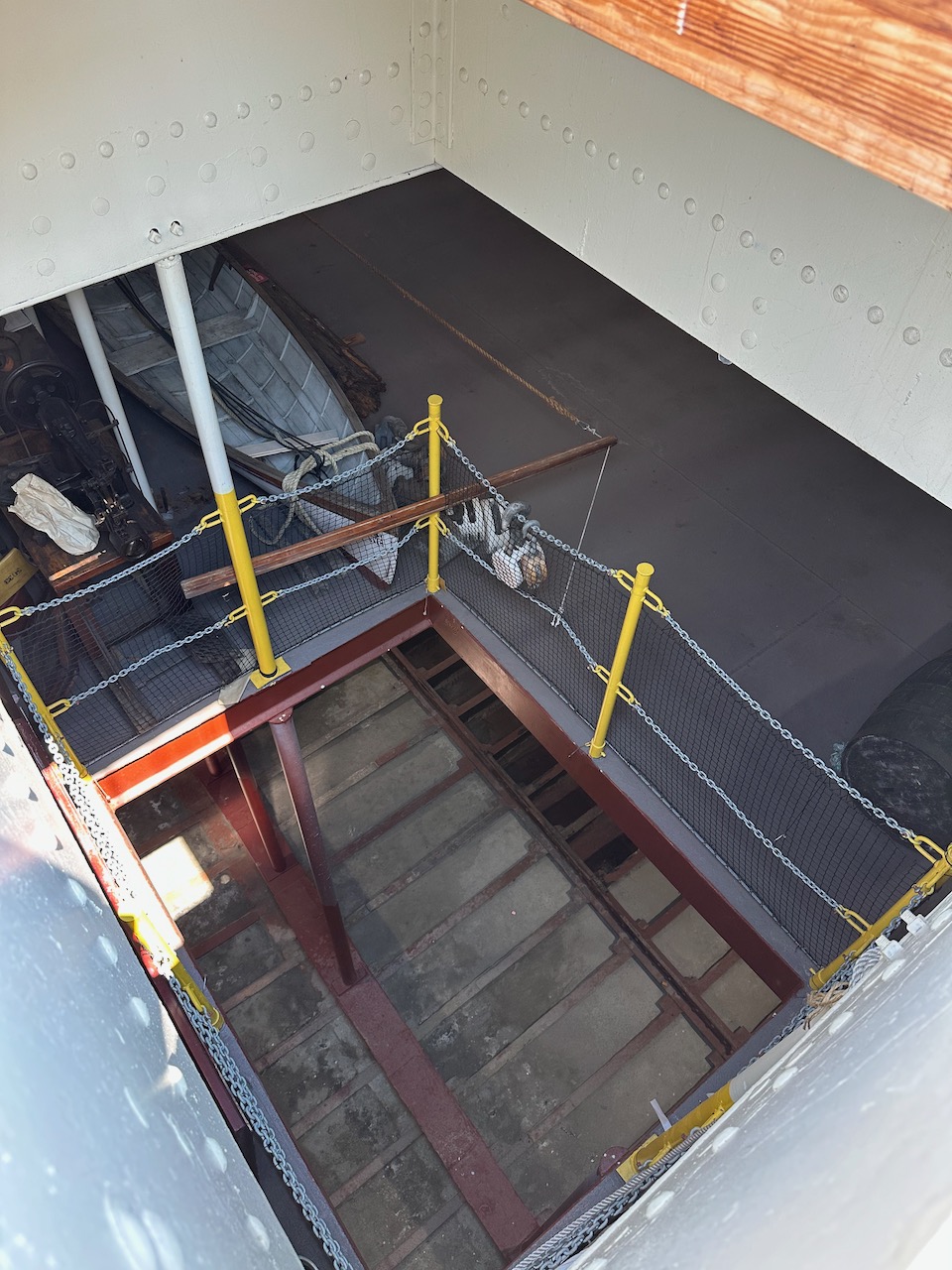 View through deck into cargo holds below.