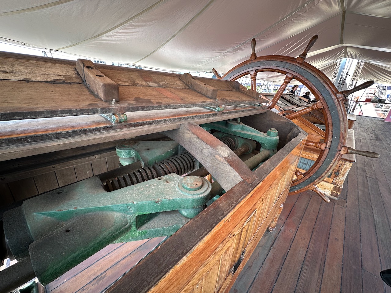 Ship's wheel and steering mechanism on poop deck.