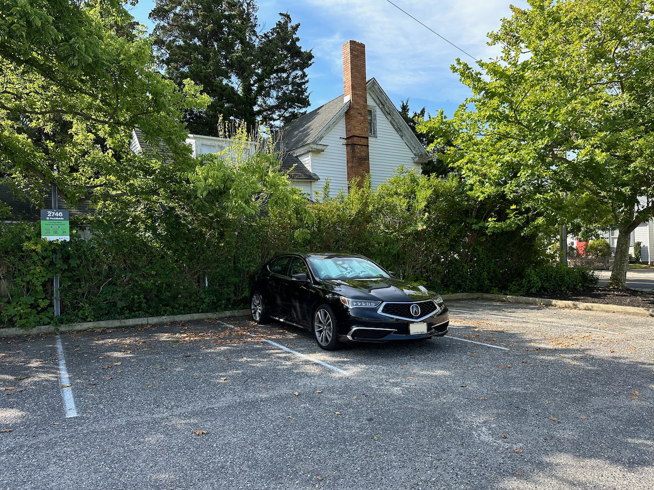 2020 Acura TLX parked in empty lot.