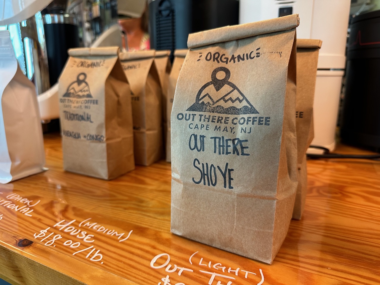 Bag of coffee beans on counter. The bag reads as follows: Organic, Out There Coffee, Cape May NJ, Out there Shoye