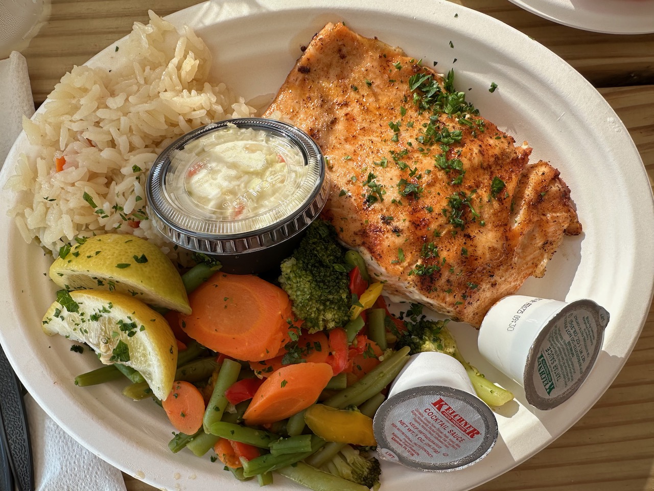 Plate with salmon, vegetables, and rice.