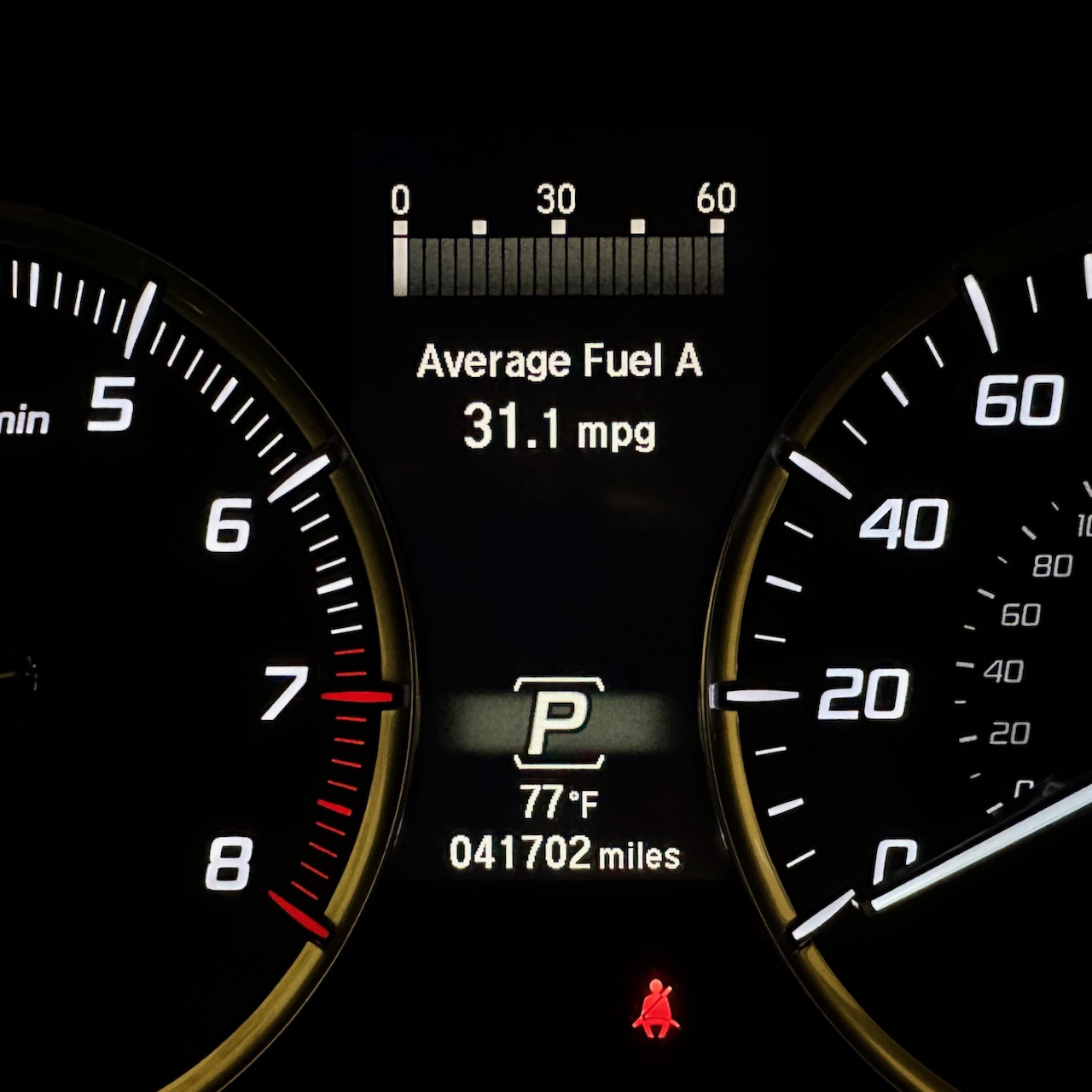 Car odometer reading 41702 miles.