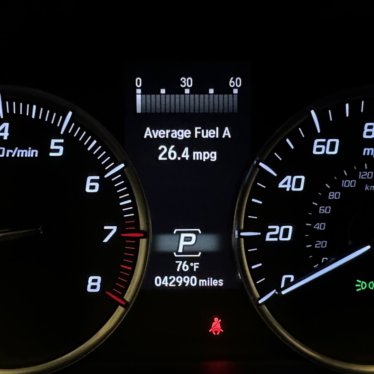 Car odometer reading 42990 miles.